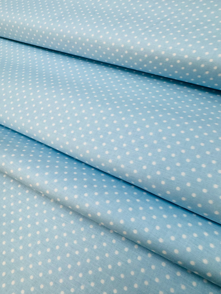 Tela básica azul con puntos blancos